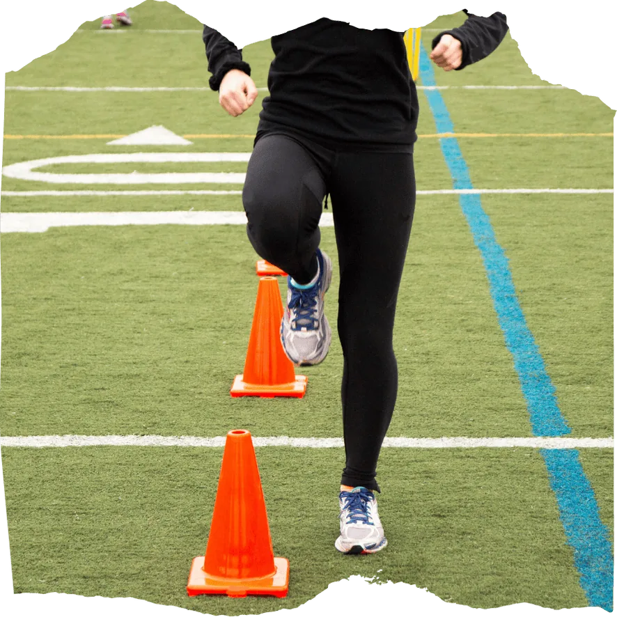 Runner doing running drills during a group workout in Munich