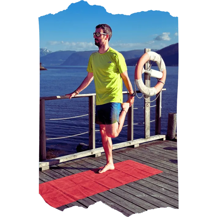 Runner stretching while reading the Future Athletes Running newsletter
